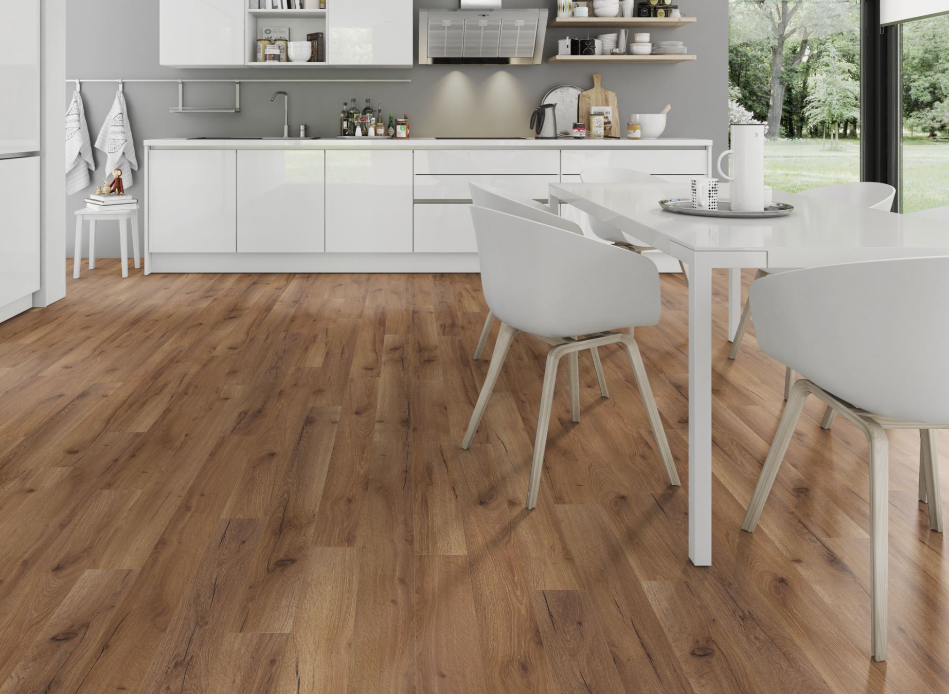 A modern kitchen featuring elegant wood floors and stylish white furniture, creating a bright and inviting atmosphere.